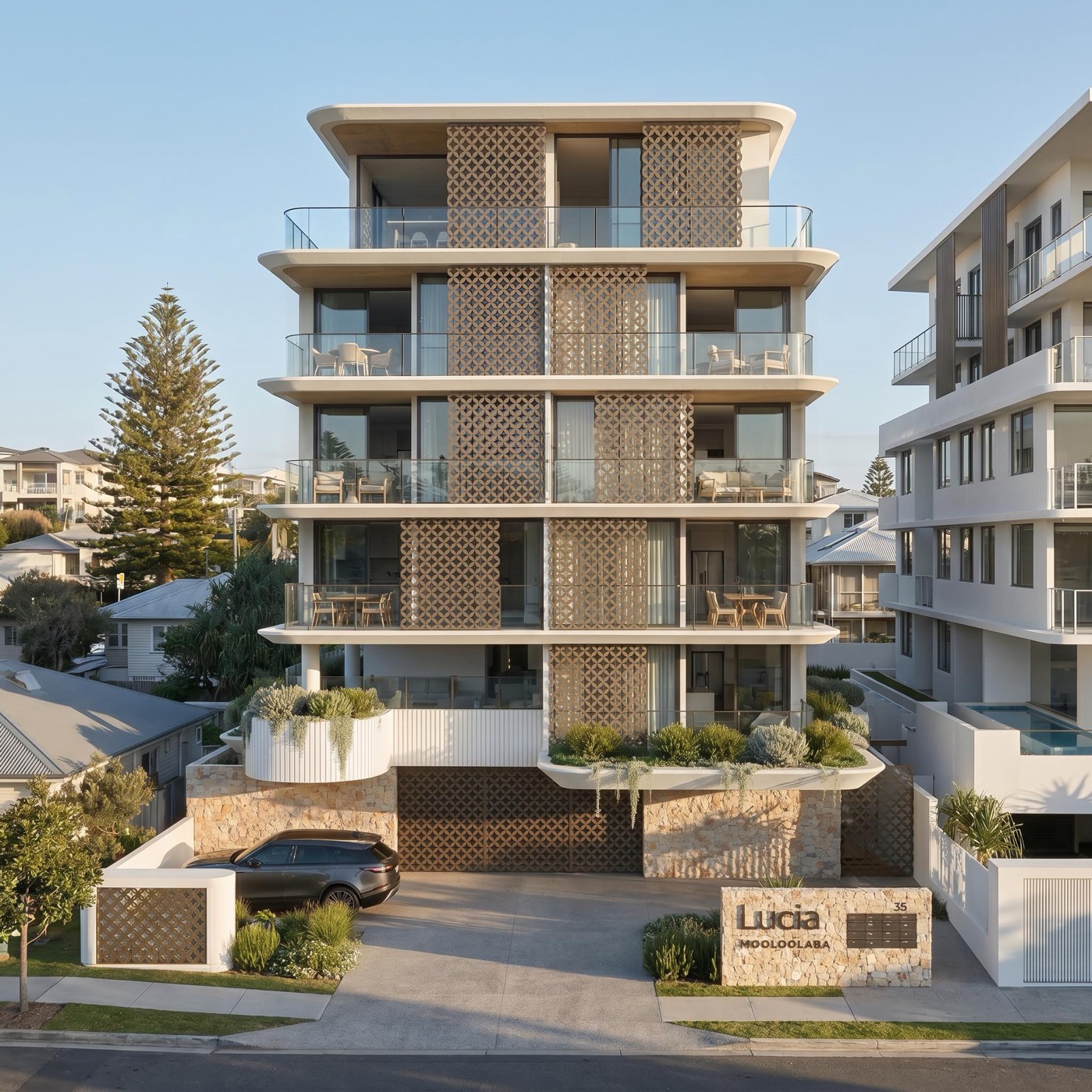 Lucia from Smith Street: a six-storey building with curved white balconies, timber screens and a stone-faced entry