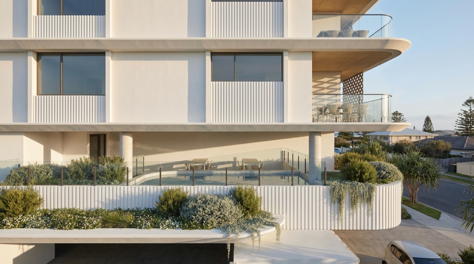 Lucia's white upper façade above a landscaped terrace