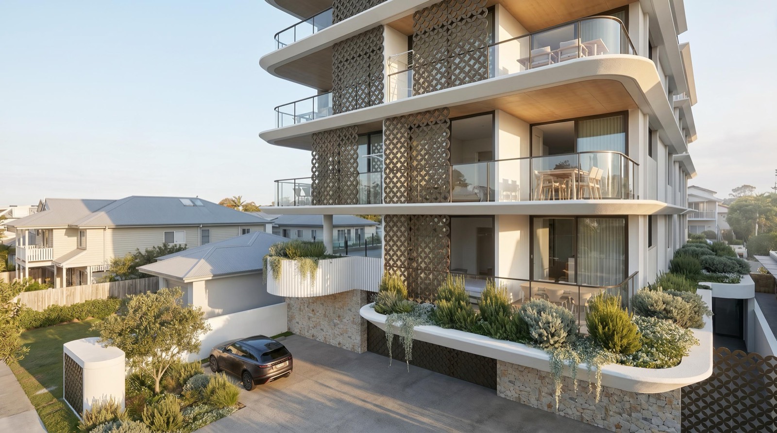 Corner view of Lucia's curved balconies with planters and timber screens